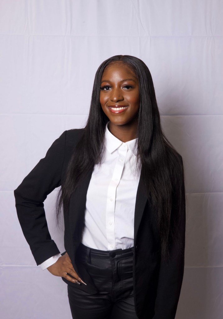Miracle Gross, Hampton University Student Business Professional Headshot in front of white wall.