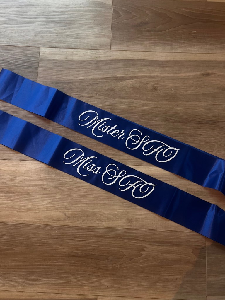 Two royal blue sashes with white cursive text reading "Miss/Mr. SFO".