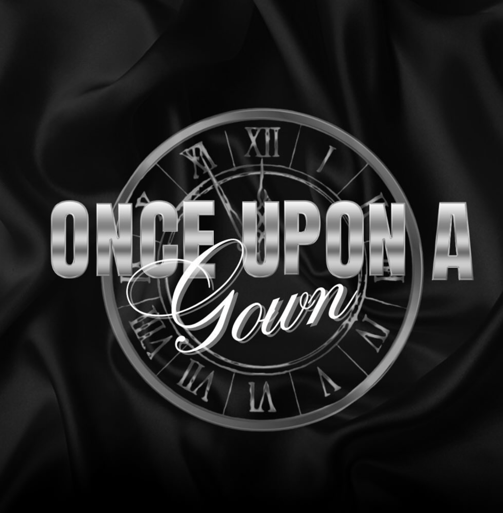 Once Upon a Gown logo with metallic lettering over a black satin background and a faint clock design symbolizing timelessness and transformation.